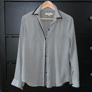 Black and white button up blouse.